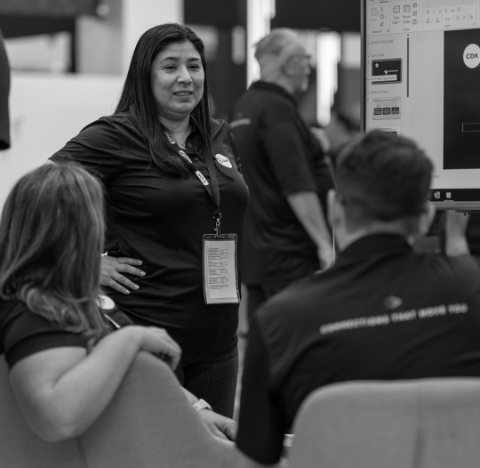 Employees talking at trade show