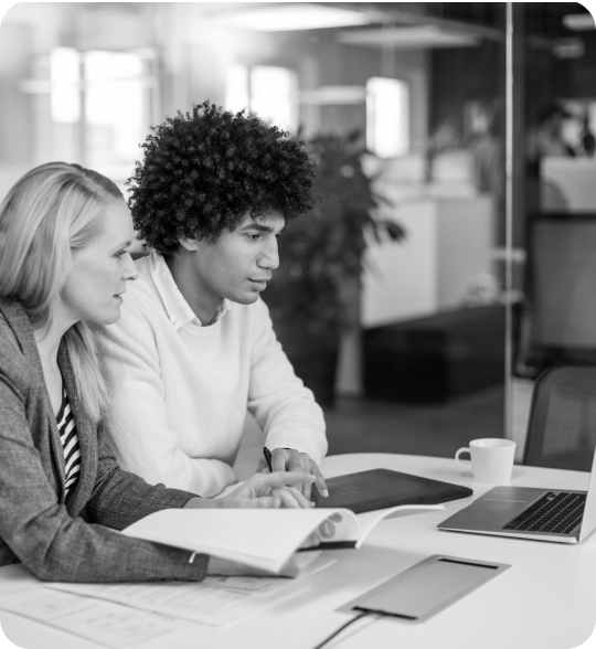 Interns looking at computer